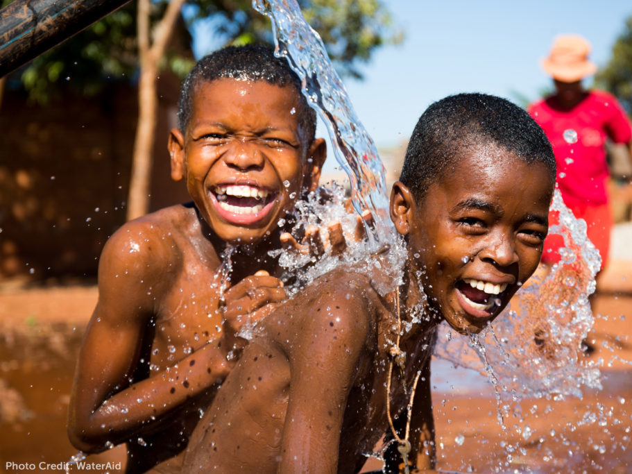 WaterAid Picture - two boys enjoying clean water